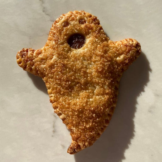 Ghost pie filled with homemade apple butter and sprinkled with raw sugar