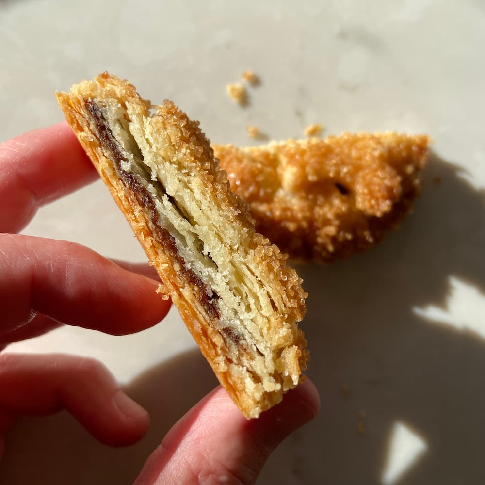 flakey pie crust filled with gingerbread cinnamon roll filling